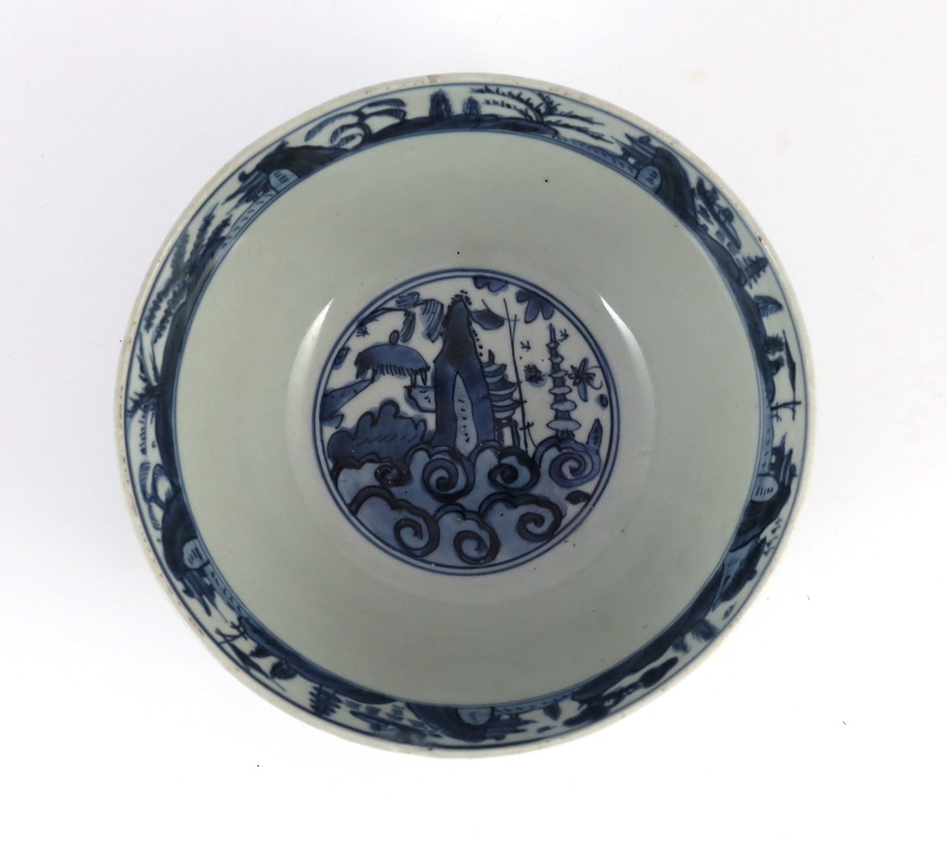 A Chinese Ming blue and white ‘lotus pond’ deep bowl, 21.5cm diameter, 10.5cm high, hairline crack to rim